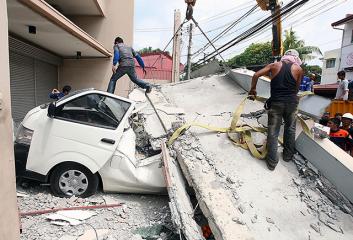 Concrete structures fall on vehicles in Cebu quake, many wrecked