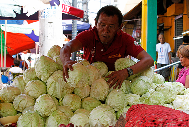 Cabbages are selling for P50 per kg. at a market in Manila on Tuesday, May 6. Philippine inflation last April came in slightly faster than market consensus, driven by higher food and utility costs. Analysts expect Bangko Sentral ng Pilipinas to tweak policy settings when the Monetary Board meets this week against the backdrop of growing money supply in the financial system.
