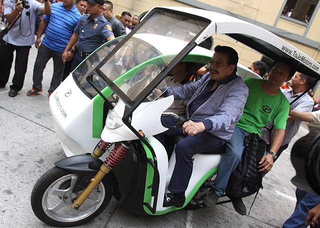 Manila Mayor Joseph Estrada on Thursday, June 5 tries a Philippine-made e-Trike which can seat seven passengers. The e-Trike has a maximum speed of 40- 45 kph. and is rechargeable for 4-5 hours using a gel-type battery. The city of Manila is planning to buy an e-Trike for each barangay. 
