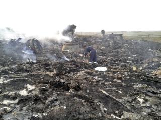 Malaysia Airlines MH17 crash site smolders