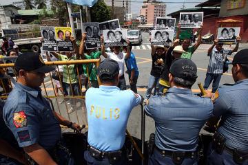 Militants rally near Aquino residence