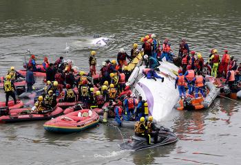 Taiwan plane cartwheels into river after take-off, killing at.