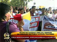 Teachers air pay grievances through Christmas carols