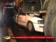 Taxi sandwiched between 2 trucks