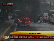 Taxi catches fire