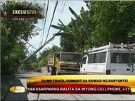 Dump truck snags power line