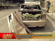Crane falls on car in Pasig, passengers survive