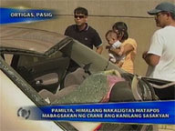  Saksi:  Family unhurt as crane falls on car