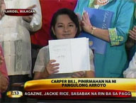 President Arroyo signs CARP extension and reform law