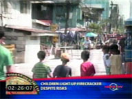  QTV:  Children light up firecracker despite risk