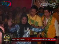 Bro. Eddie, party-mates seen putting money on native dancers' 'malong'