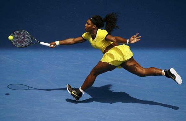 Serena Williams stretches for a shot during her quarter-final match against Russia's Maria Sharapova at the Australian Open tennis tournament at Melbourne Park, Australia. REUTERS
