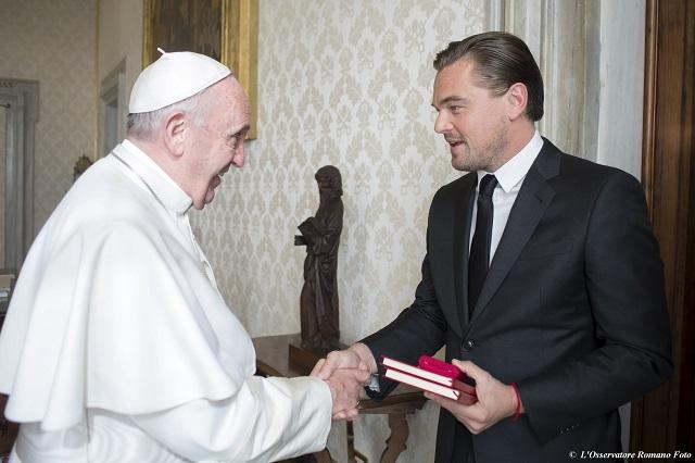Pope Francis shakes hands with actor Leonardo DiCaprio at the Vatican. REUTERS