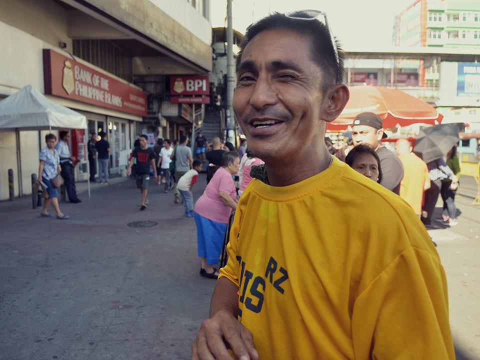 Sunny, an ex-convict, now makes a living selling handkerchiefs outside Quiapo Church