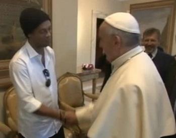 Pope Francis meets international football star Ronaldinho. REUTERS