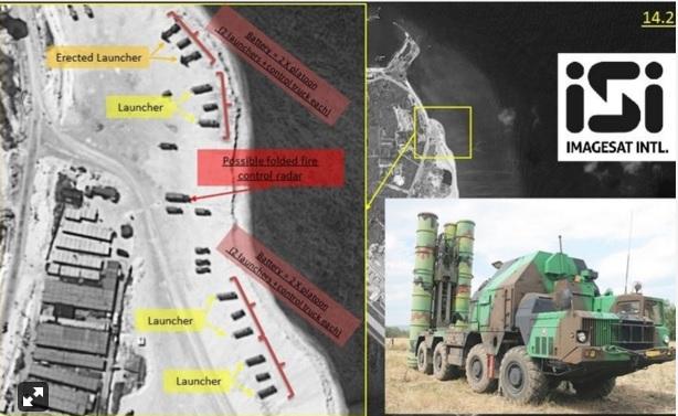 A picture combo shows satellite images showing the deployment of surface to air missile launchers on Woody Island in the Chinese-occupied but Vietnam-claimed Paracel Islands and a photo of the mobile missile launcher which the Chinese military allegedly positioned in the disputed territory. 