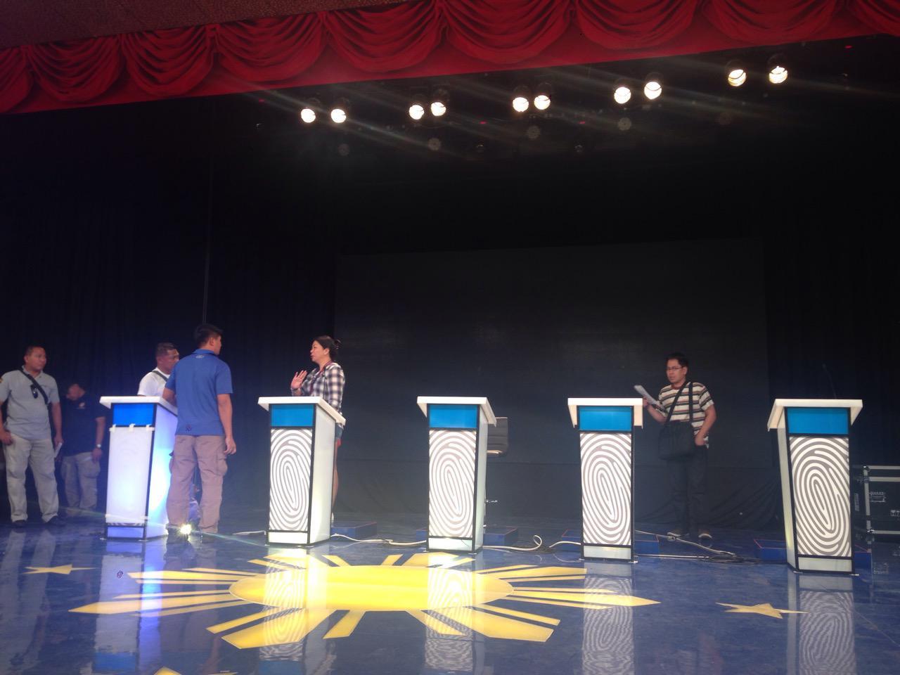 Technical staff check on the stage where Sunday's debate will be held. Photo by JESSICA BARTOLOME, GMA News