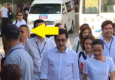 Retired Marine colonel Ariel Querubin (indicated by arrow) was part of Sen. Grace Poe's coterie when she arrived at the debate venue in UP Cebu. Photo by DANNY PATA, GMA News 