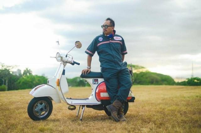 Abet Rana, past president of the Vespa Club of the Philippines, on his PX150 scooter. Photo by Paul Vincent courtesy of Abet Rana