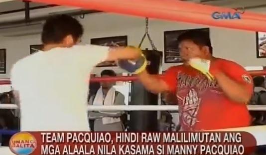 Buboy Fernandez (right) on the ring with Pacquiao