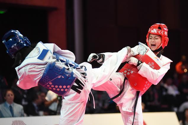  Philippines' Pauline Lopez (red) tangles with Malaysia's Nurul Roslan in the -47 kilogram division of the Asian Taekwondo Olympic qualifying tournament. Photo by MARTIN SAN DIEGO, GMA News
