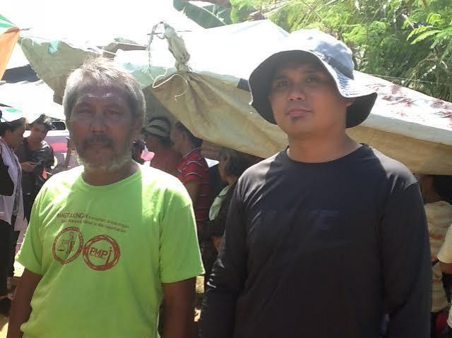 Save Manicani Movement chairmanMarcial Sumooc with Father Nino Garcia. Photo by ELMER RECUERDO, GMA News