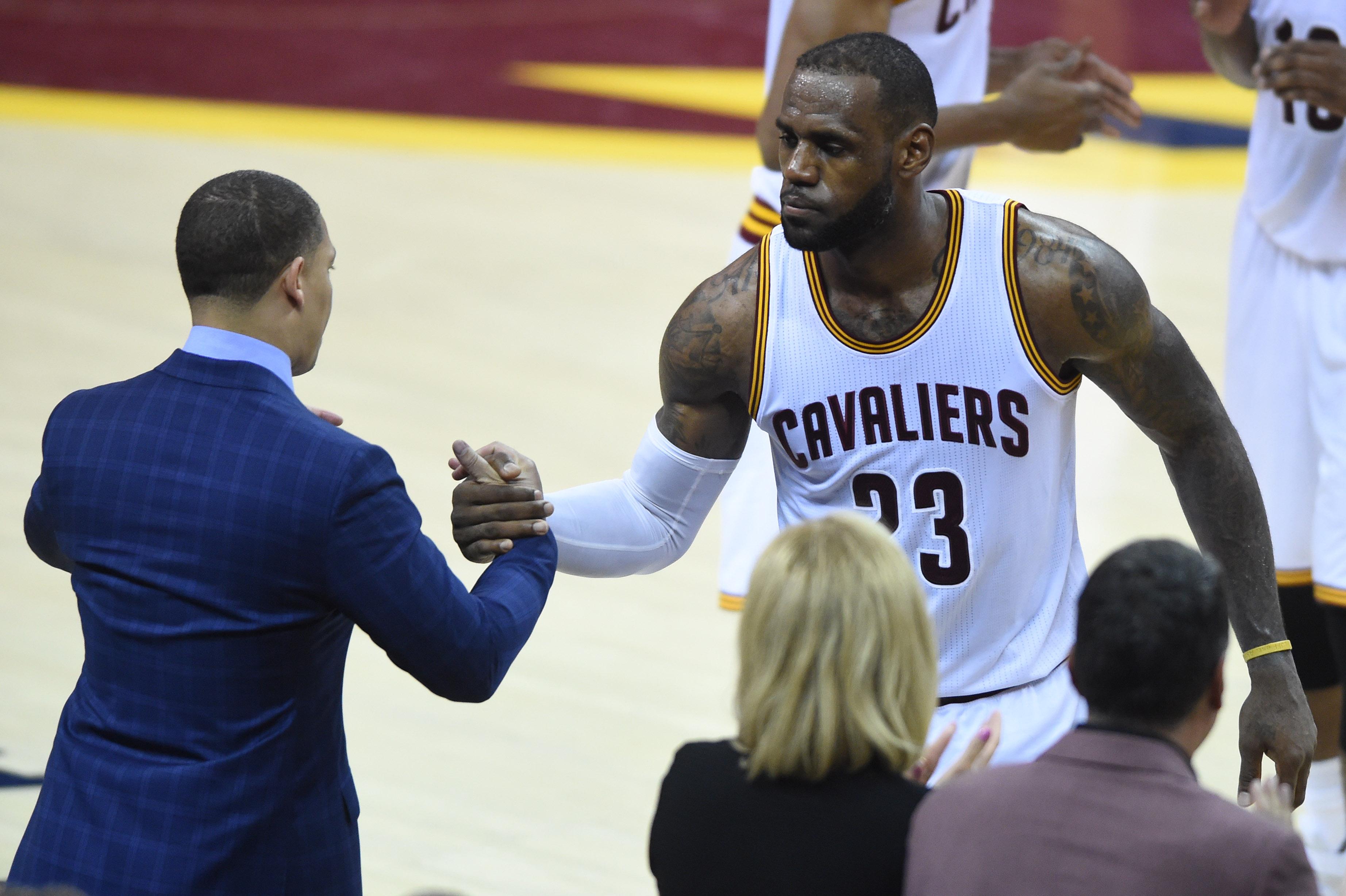 LeBron James celebrates with coach Tyronn Lue Photos GMA News Online