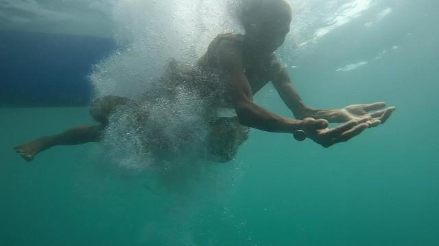 VIDEO: 74-year-old grandma dives into the ocean to get coins