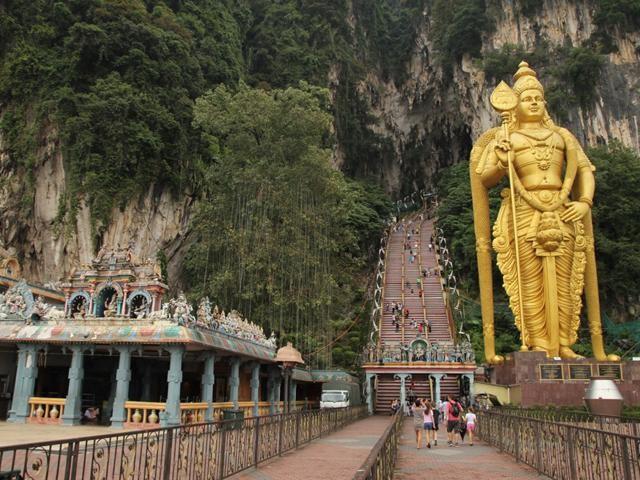 After being mesmerized by the 43-meter, gold statue of Lord Murugan, start the 272-step trek to the Temple Cave. Photos: Stanley See.