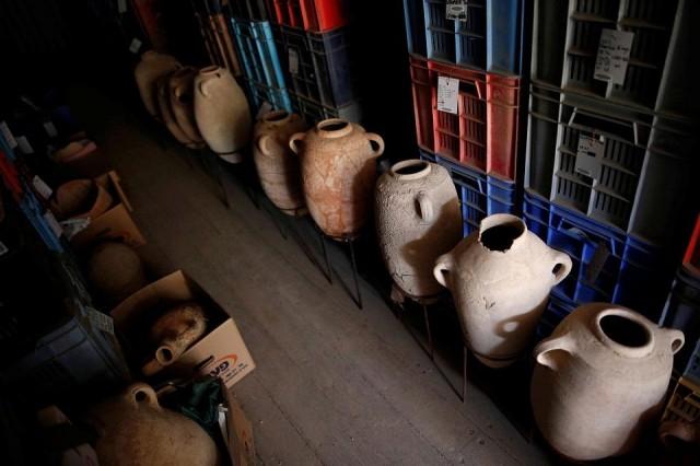 Clay items unearthed during excavations at the first-ever Philistine cemetery in Ashkelon National Park, are displayed at an exhibition in the Rockefeller Museum in Jerusalem July 6, 2016. Picture taken July 6, 2016. REUTERS/Amir Cohen