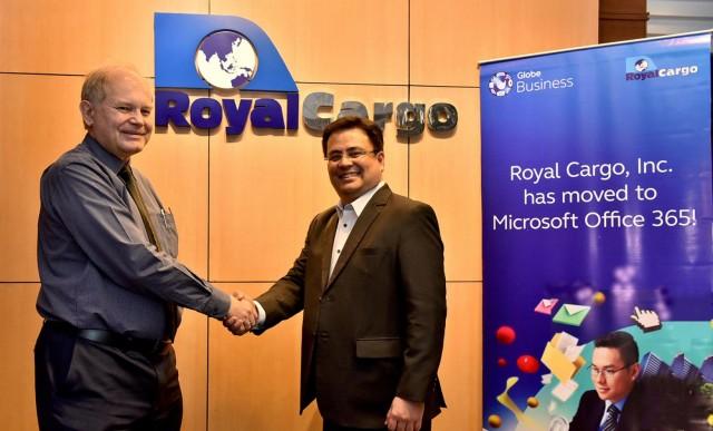 (From R-L) Dion Asencio, Globe Vice President for Enterprise Sales and Michael Raeuber, Royal Cargo Group Chief Executive Officer seal the partnership between Globe and Royal Cargo for theuse of Microsoft O365.