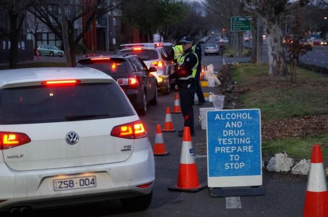 Random breath testing to detect alcohol is a highly visible exercise. Such tests could be encountered anywhere and at any time in the land Down Under. Photo: WHO/Passmore