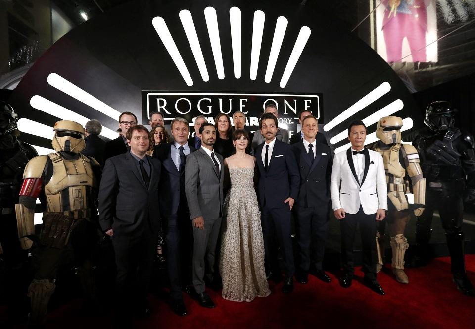 The cast and crew pose on the red carpet as they arrive at the world premie...