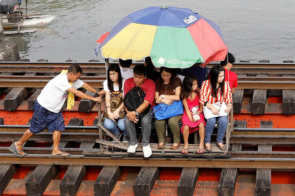 Wooden Trolleys Provide Alternative Means Of Transportation In Manila wooden-trolleys-provide-alternative-means-of-transportation-in-manila