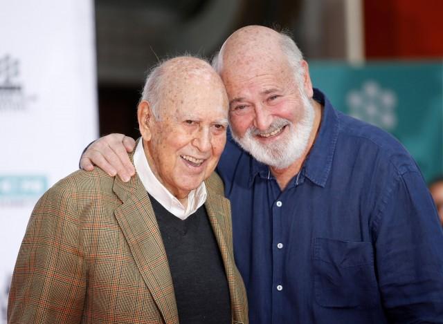 Actors, directors and producers Rob Reiner (R) and his father Carl Reiner pose during their Hand and Footprint Ceremony presented as part of the 2017 TCM Classic Film Festival in the forecourt of the TCL Chinese Theatre IMAX, in Hollywood, California, U.S. April 7, 2017. REUTERS/Danny Moloshok