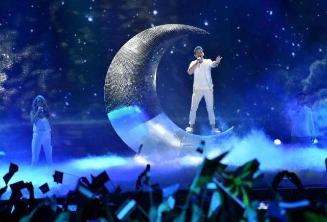 Austria's Nathan Trent singing 'Running On Air.' AFP