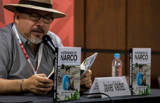 This file photo taken on November 27, 2016 shows Mexican journalist Javier Valdez speaking during the presentation of his book 