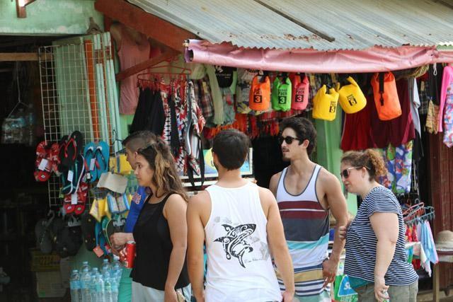 Foreign tourists stroll beaches in Puerto Princesa City.