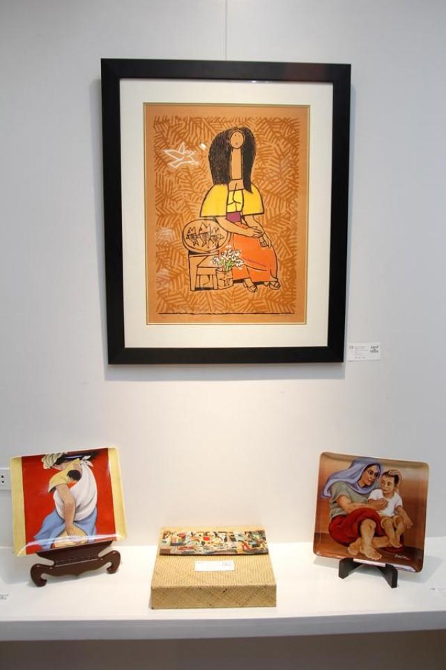  Aside from prints on paper like Malang&acirc;s Untitled (Fish Vendor, center), other pieces in the collection include ceramics by BenCab (Mag-Ina, left, and Mother and Child, right), and a screen print on capiz by Manansala (lower center). 