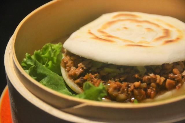 the braised pork-stuffed burger is a common Xi'an street food.
