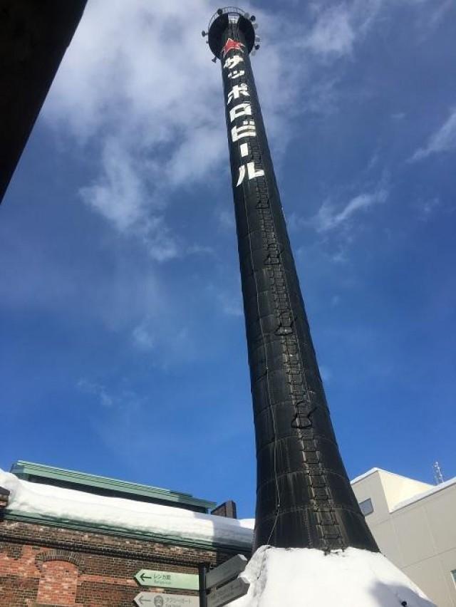 The unmistakeable meters-tall black chimney with red star and Nihonggo lettering belongs to the Sapporo Factory; a former brewery that now houses a cinema and shopping complex.