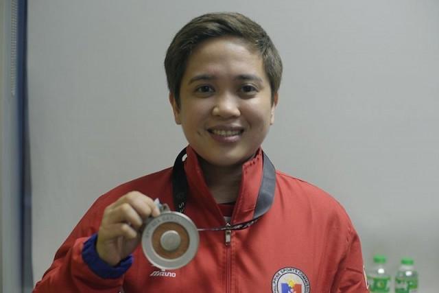 Rubilen Amit showing off her medal from the SEA games. Photo: Jessica Bartolome