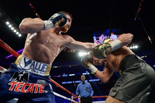 Sep 16, 2017; Las Vegas, NV, USA; Gennady Golovkin (green trunks) and Canelo Alvarez (blue trunks) box during the world middleweight boxing championship at T-Mobile Arena. The bout ended in a draw. Mandatory Credit: Joe Camporeale-USA TODAY Sports / Reuters