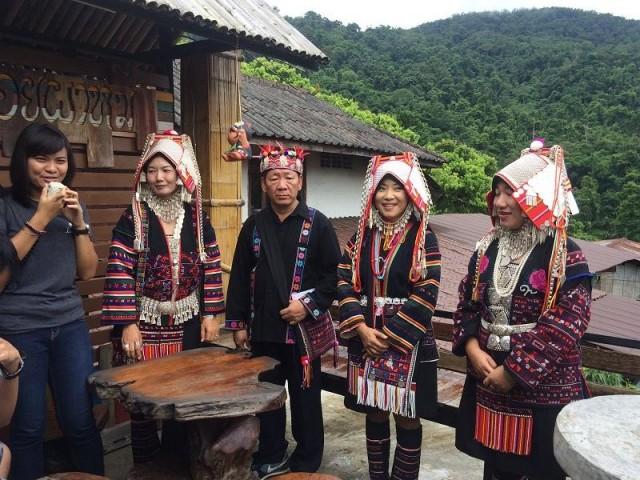 Akha tribe members wearing traditional costumes at Doi Pha Mee. The polwang (second from left) stands as their community leader. The headrest of the female tribe members can weigh as heavy as six kilograms. 