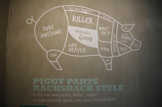 Pig-related images as well as loud phrases/statement accompany Rackshack&acirc;s industrial interiors.