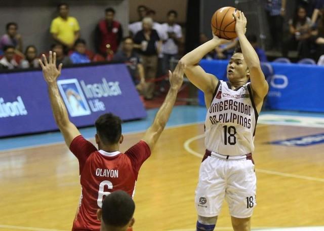 UP's Paul Desiderio shoots over UE's Mark Olayon. Photo by KC Cruz