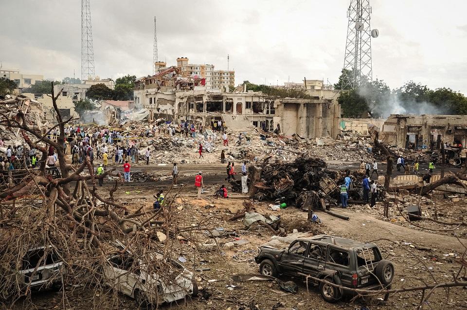 A picture taken on October 15, 2017 shows a general view of the scene of the explosion of a truck bomb in the center of Mogadishu. A truck bomb exploded outside a hotel at a busy junction in Somalia's capital Mogadishu on October 14, 2017 causing widespread devastation that left at least 20 dead, with the toll likely to rise. Mohamed Abdiwahab/AFP