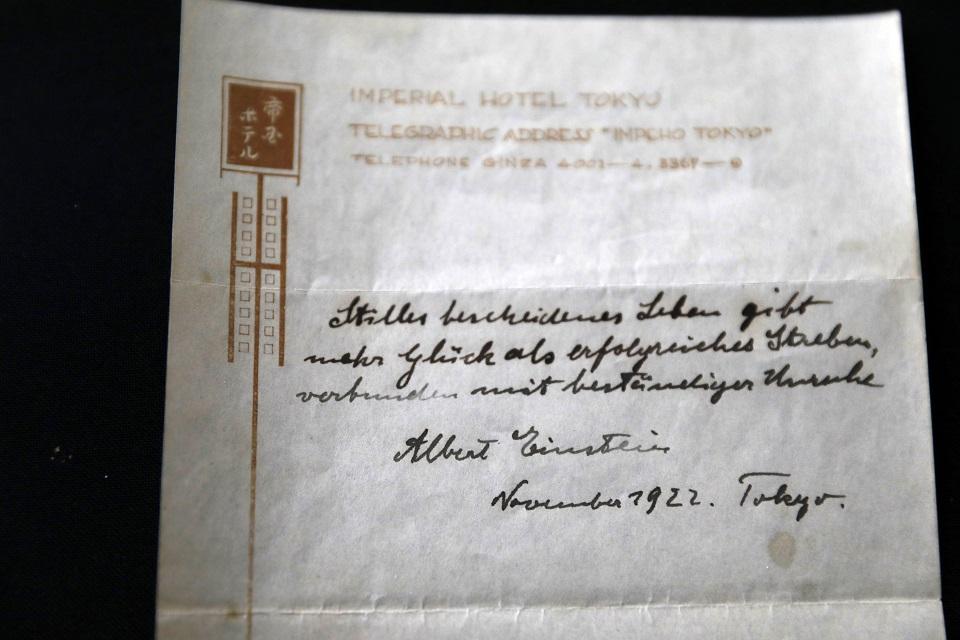 One of two notes written by Albert Einstein in 1922, on hotel stationary from the Imperial Hotel in Tokyo, is displayed by Winner's auction house on October 19, 2017. Menahem Kahana/AFP