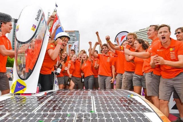Crew members of the Dutch team Nuon celebrate after winning the World Solar Challenge in Adelaide on October 12, 2017. Brenton Edwards/AFP