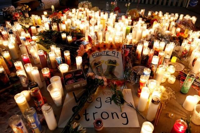 A candlelight vigil is pictured on the Las Vegas strip following a mass shooting at the Route 91 Harvest Country Music Festival in Las Vegas, Nevada, US, October 2, 2017. REUTERS/Chris Wattie